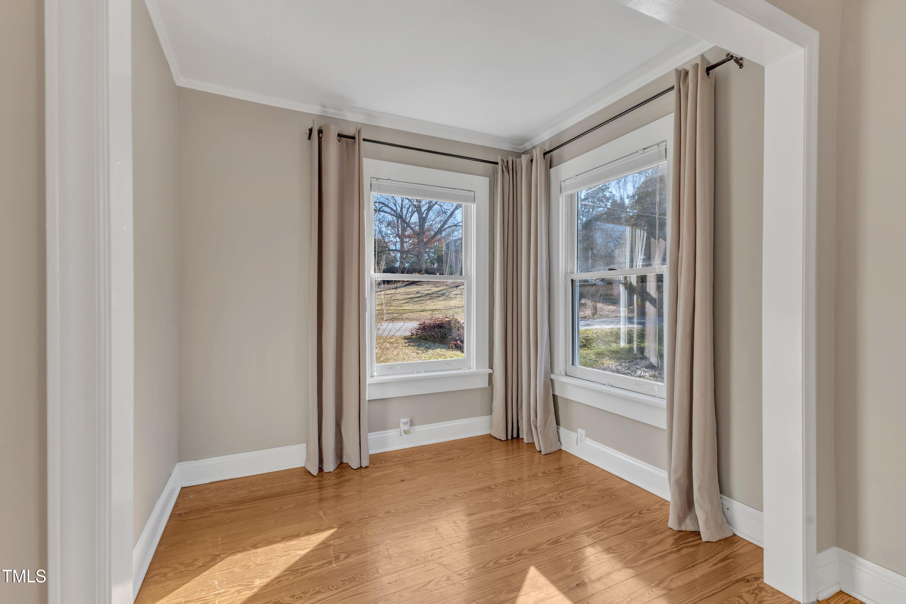152 East Tryon Street Hillsborough, NC 27278 - Photo 16 of 34 a view of an empty room and window