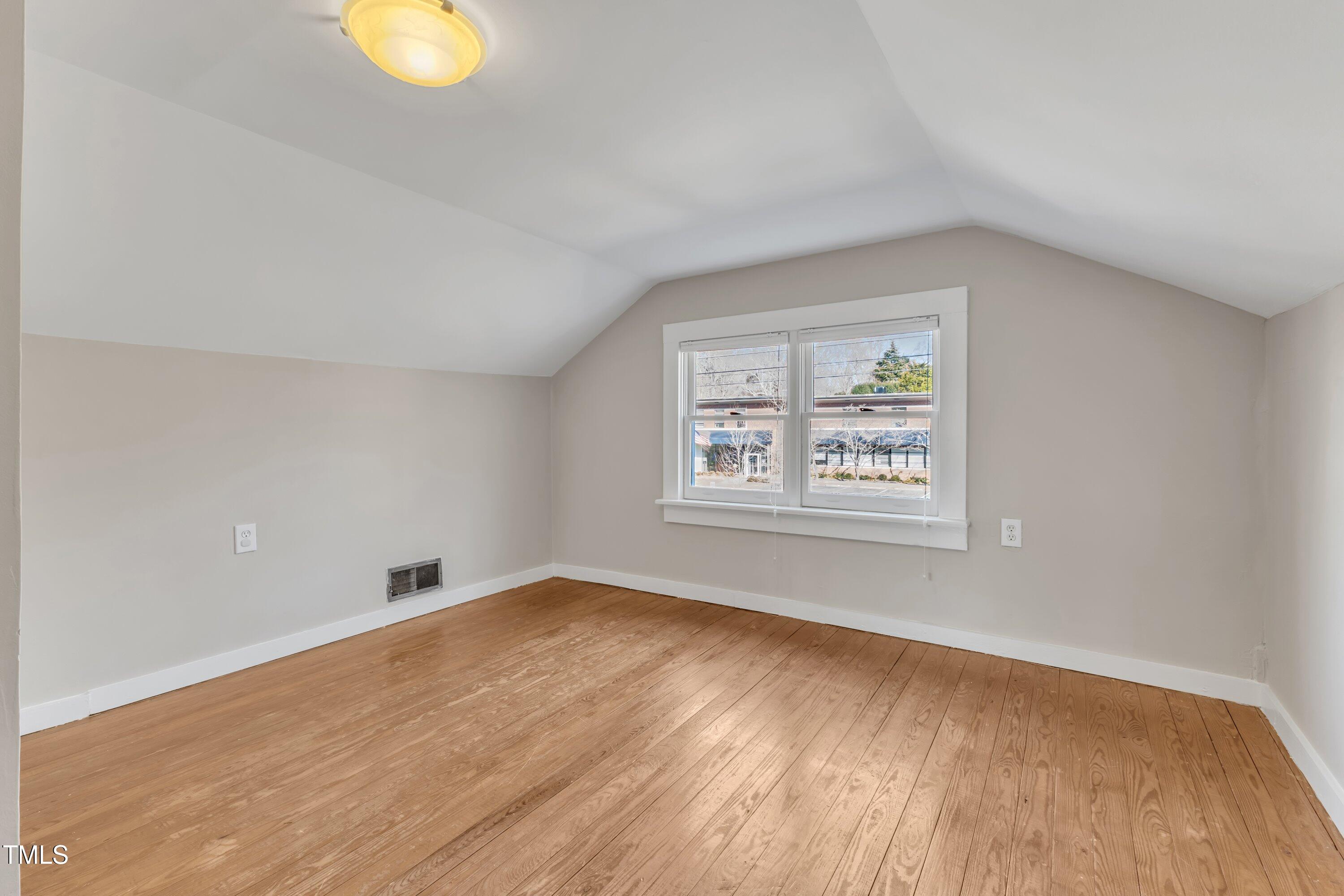 152 East Tryon Street Hillsborough, NC 27278 - Photo 26 of 34 a view of an empty room with a window