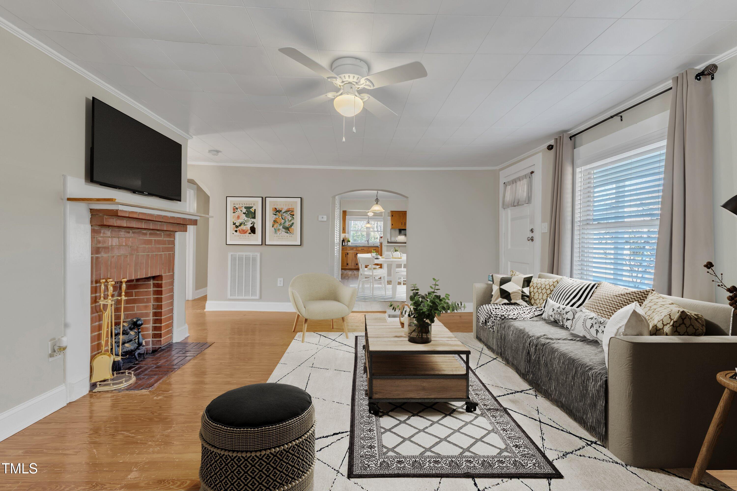 152 East Tryon Street Hillsborough, NC 27278 - Photo 6 of 34 a living room with furniture a rug and a flat screen tv