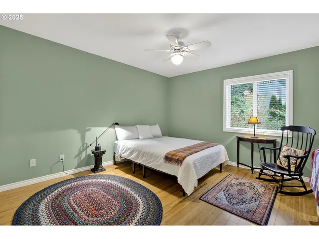 a bedroom with a bed and a table