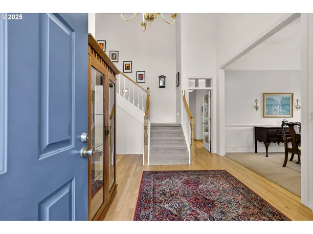 a view of entryway with furniture and wooden floor