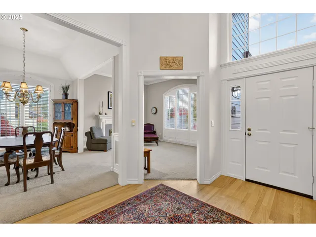 a view interior of a house and livingroom with furniture wooden floor a chandelier