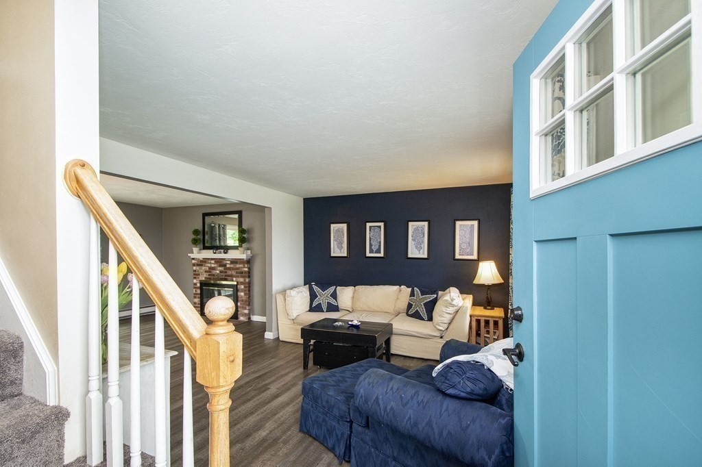 3 Battery Road Hull, MA 02045 - Photo 14 of 42 a living room with furniture and a floor to ceiling window