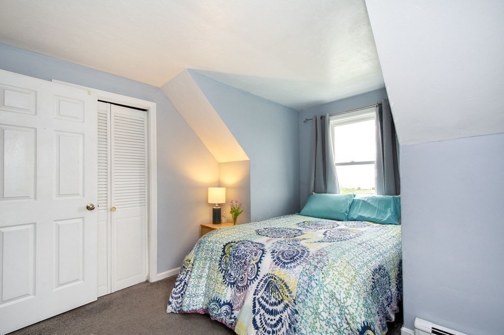 3 Battery Road Hull, MA 02045 - Photo 30 of 42 a bedroom with a bed and a window