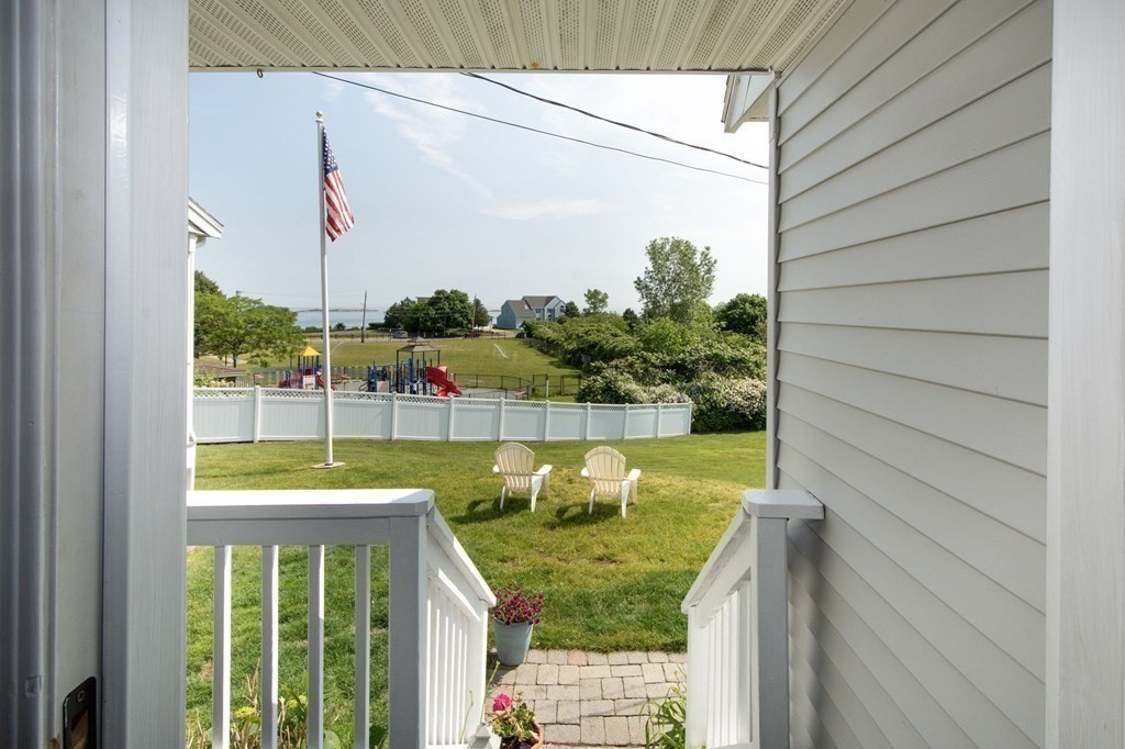 3 Battery Road Hull, MA 02045 - Photo 32 of 42 a view of a balcony with floor to ceiling windows and wooden floor