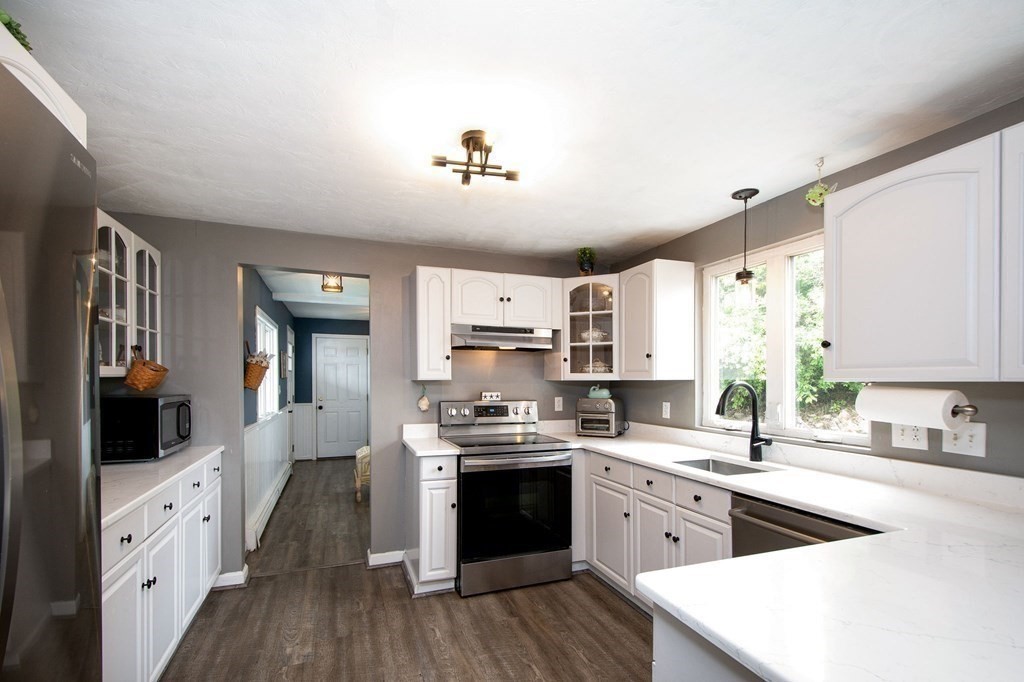 3 Battery Road Hull, MA 02045 - Photo 6 of 42 a kitchen with cabinets a sink and appliances
