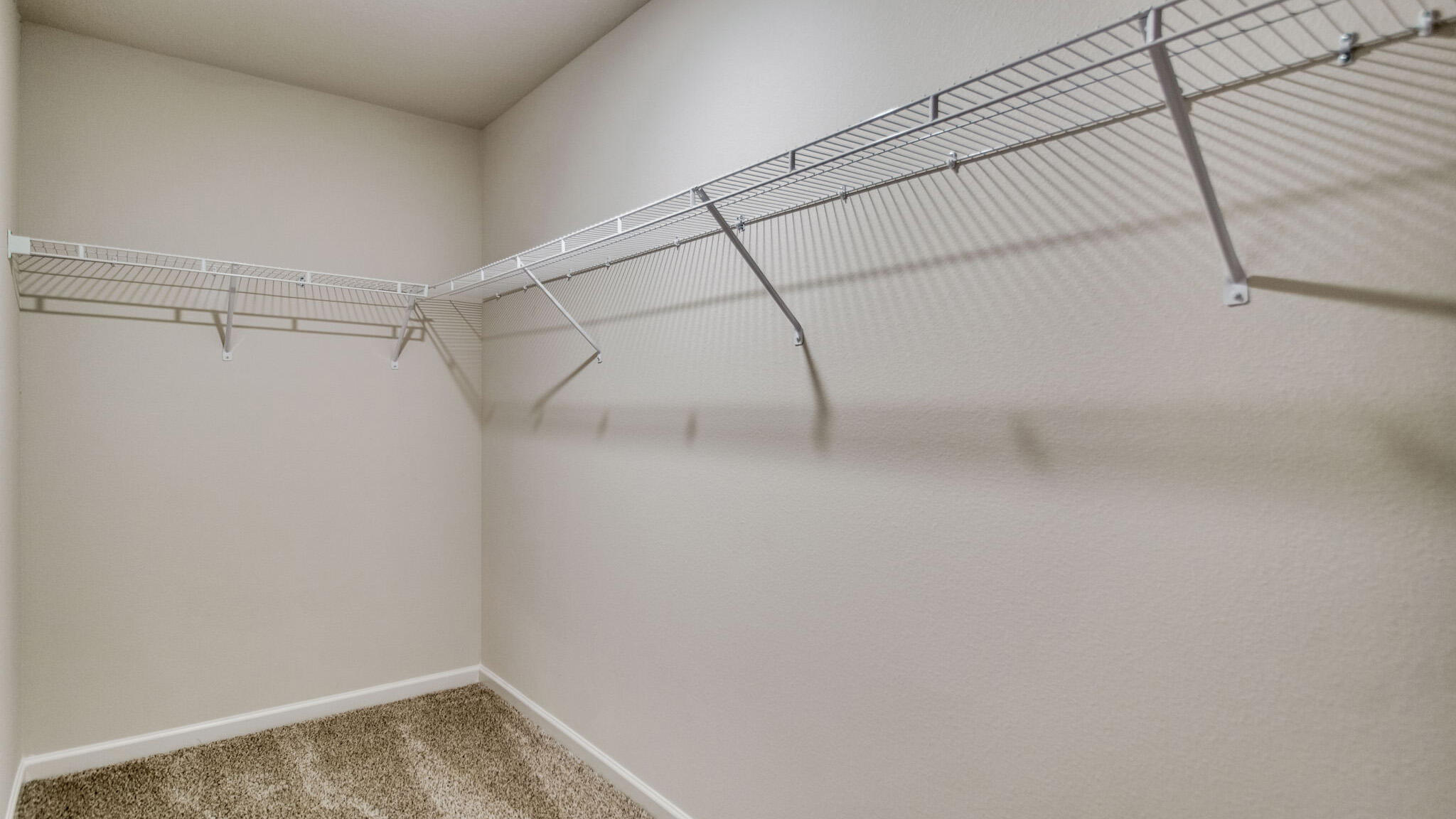 5614 Thatcher Road Crestview, FL 32539 - Photo 21 of 30 a view of a room with racks on the wall