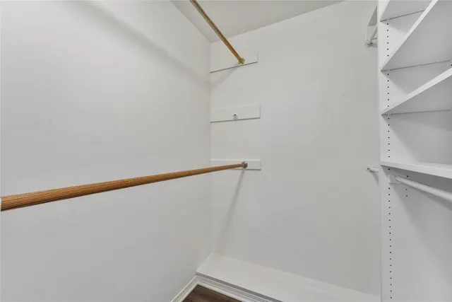 a view of sitting area with furniture and wooden floor