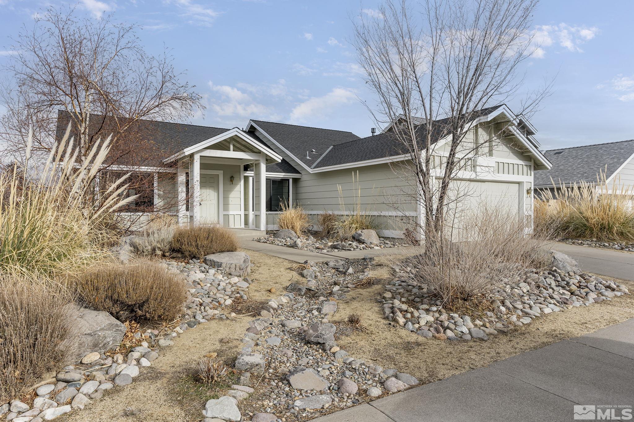 5267 Simons Drive Reno, NV 89523 - Photo 1 of 33 a front view of a house with a yard and garage