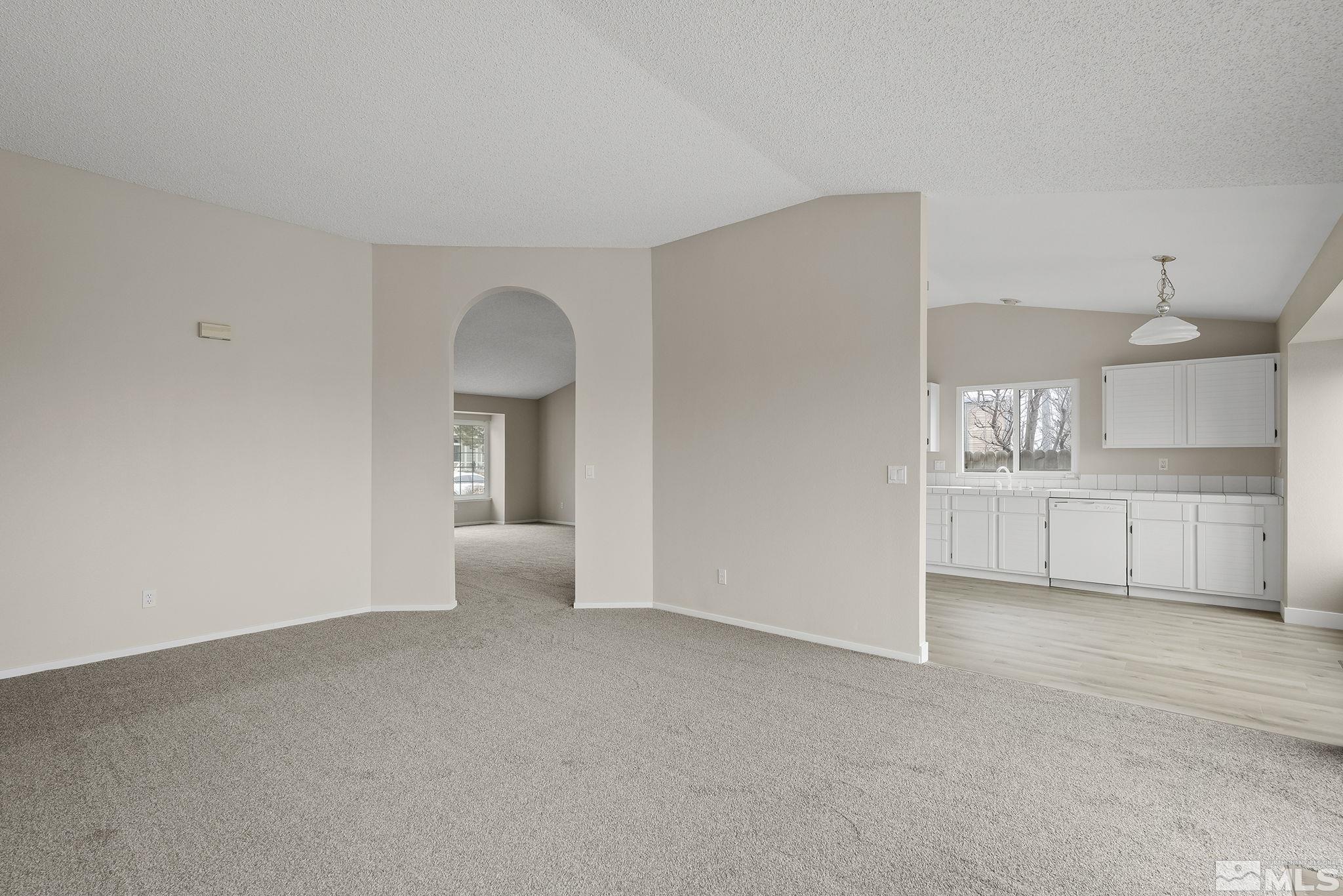 5267 Simons Drive Reno, NV 89523 - Photo 11 of 33 a view of a kitchen with wooden cabinet and a fireplace