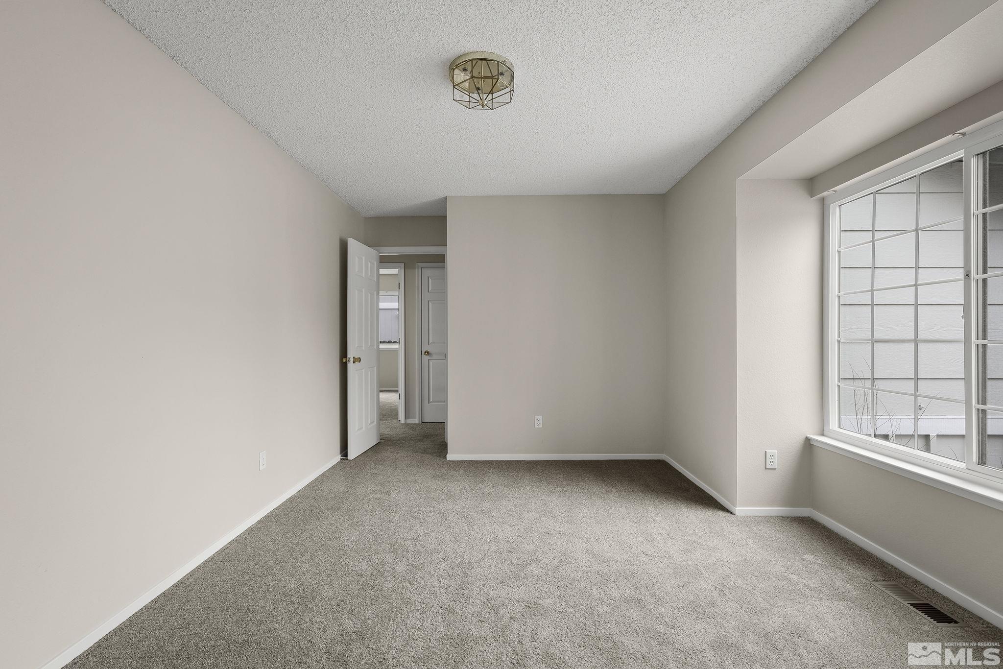 5267 Simons Drive Reno, NV 89523 - Photo 13 of 33 an empty room with a window