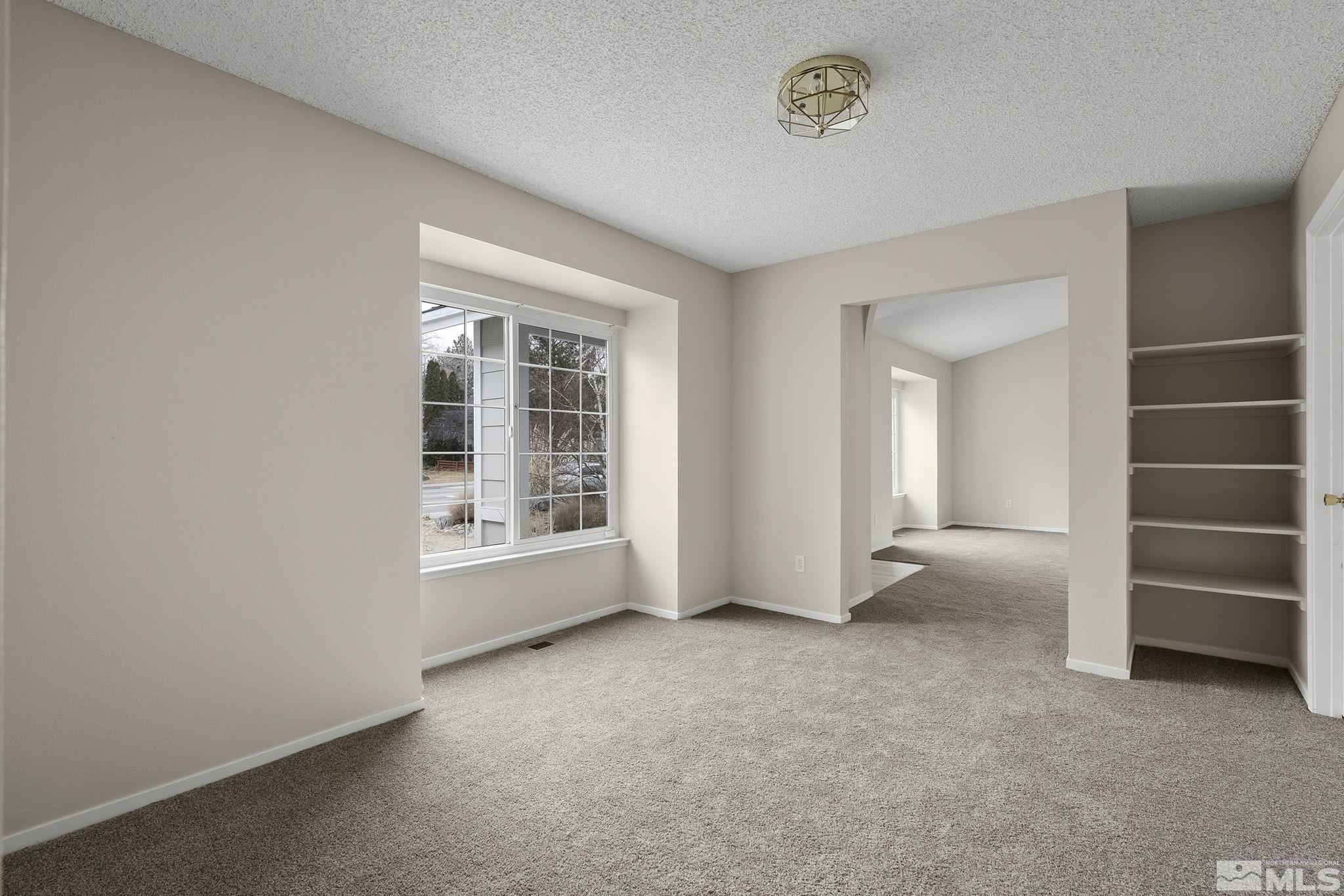 5267 Simons Drive Reno, NV 89523 - Photo 15 of 33 an empty room with a empty space and windows