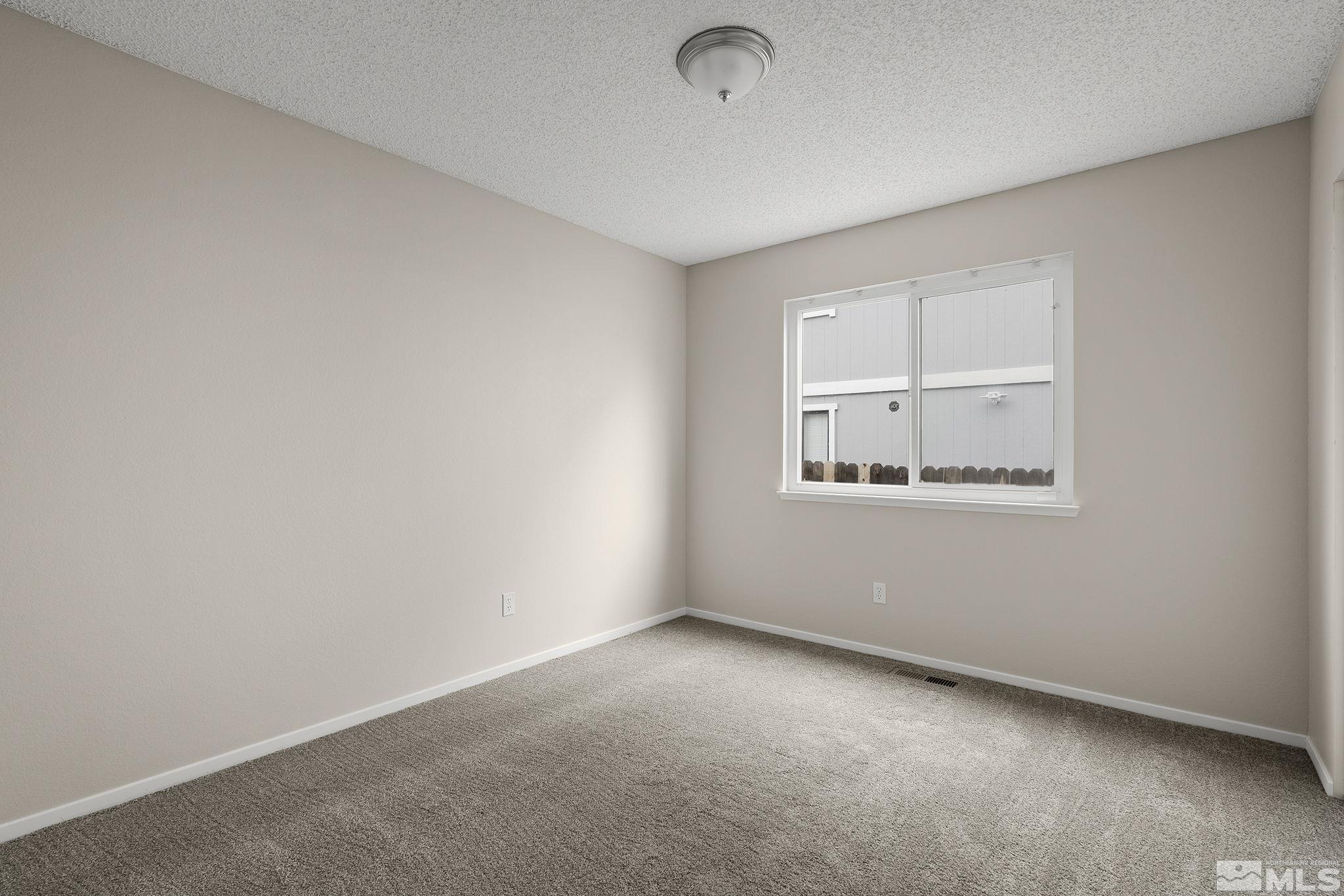 5267 Simons Drive Reno, NV 89523 - Photo 20 of 33 an empty room with a window