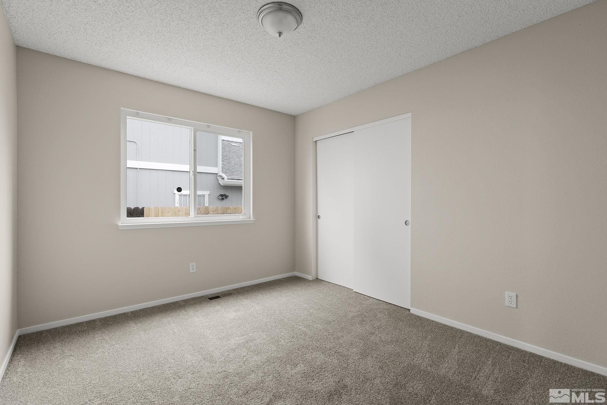 5267 Simons Drive Reno, NV 89523 - Photo 21 of 33 an empty room with windows