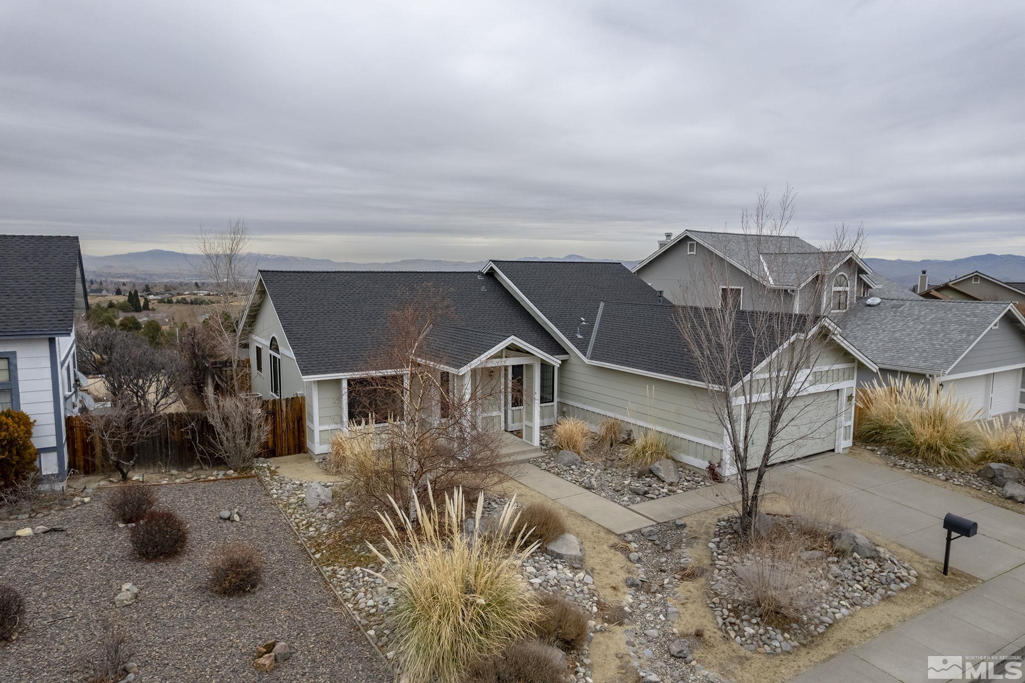 5267 Simons Drive Reno, NV 89523 - Photo 25 of 33 a view of a big house with wooden fence