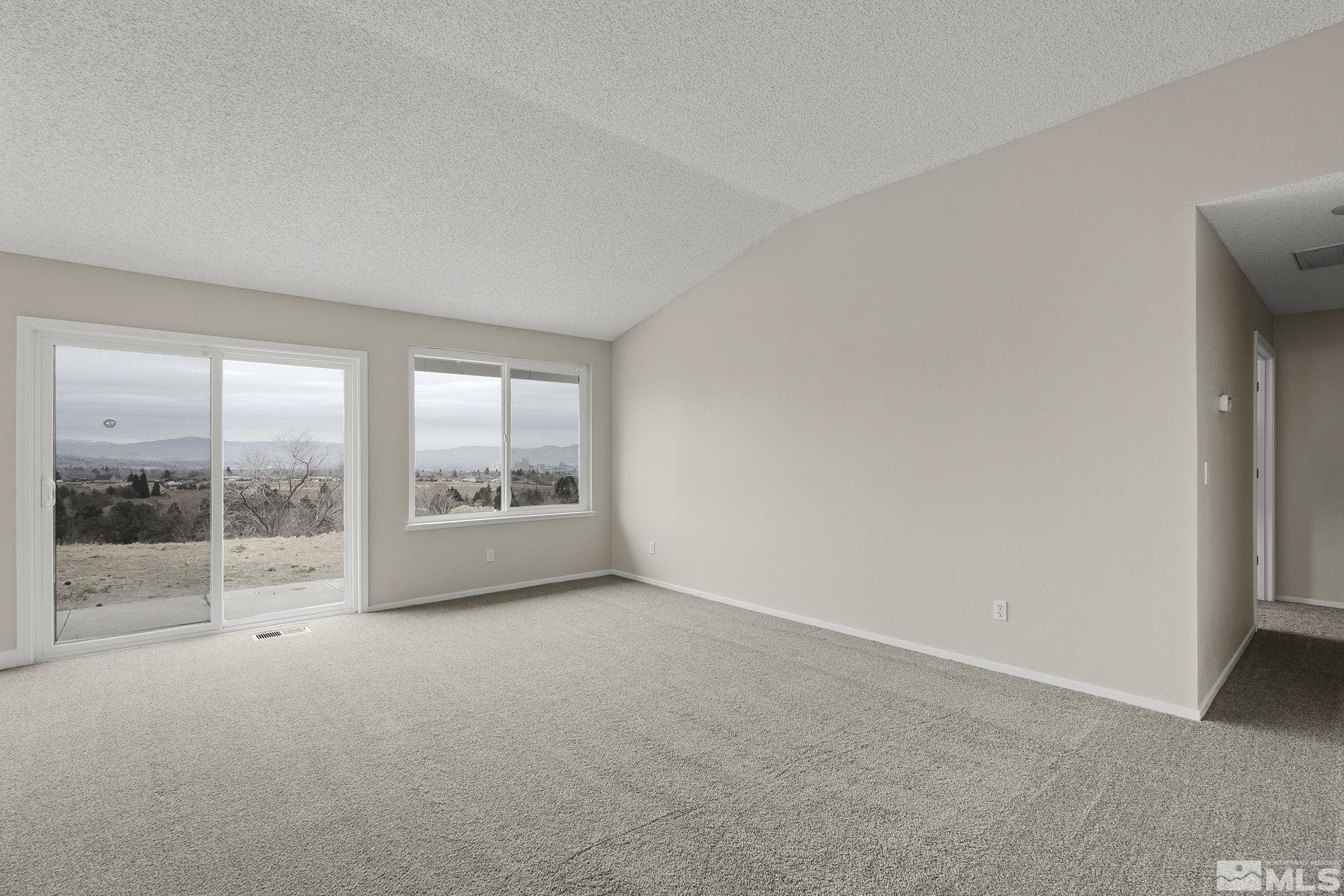 5267 Simons Drive Reno, NV 89523 - Photo 9 of 33 a view of an empty room with a window