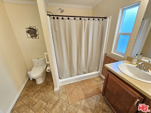 a bathroom with a sink a toilet and a tub
