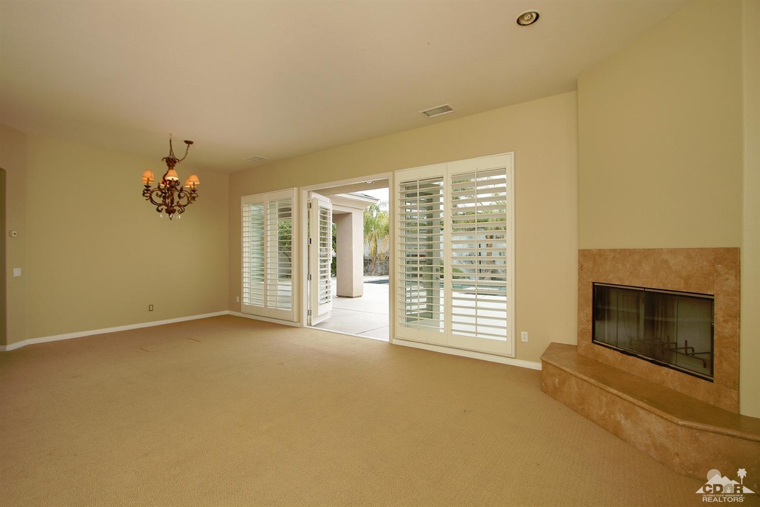 4 Orleans Road Rancho Mirage, CA 92270 - Photo 14 of 35 a view of an empty room with a fireplace