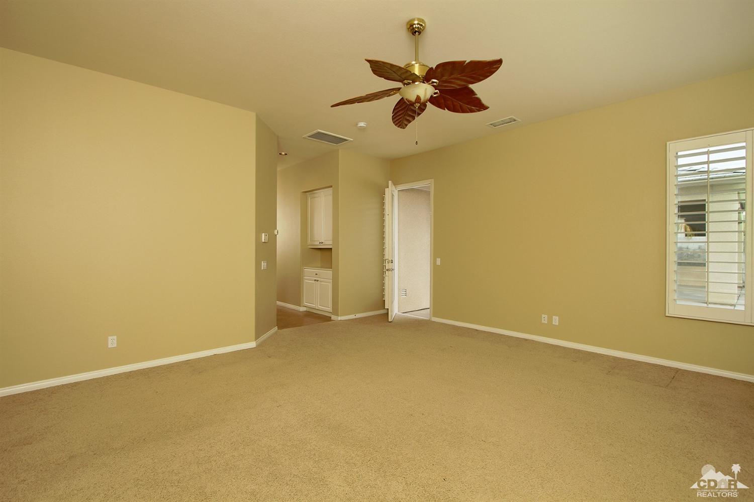 4 Orleans Road Rancho Mirage, CA 92270 - Photo 19 of 35 a view of an empty room with a window