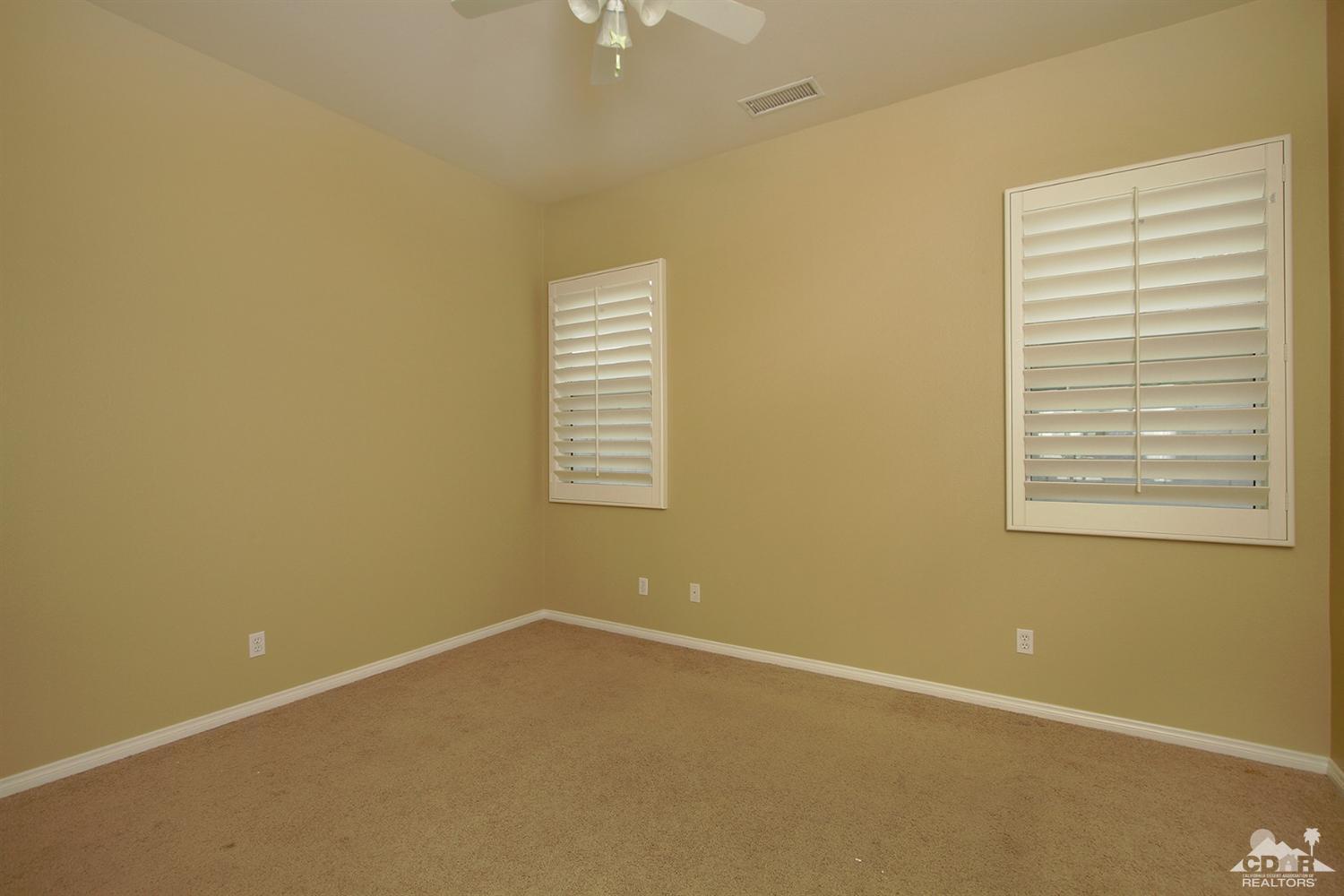 4 Orleans Road Rancho Mirage, CA 92270 - Photo 24 of 35 an empty room with windows