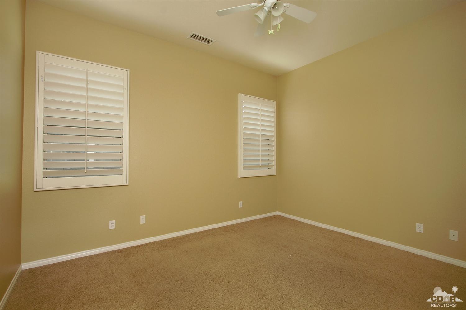 4 Orleans Road Rancho Mirage, CA 92270 - Photo 25 of 35 an empty room with a window