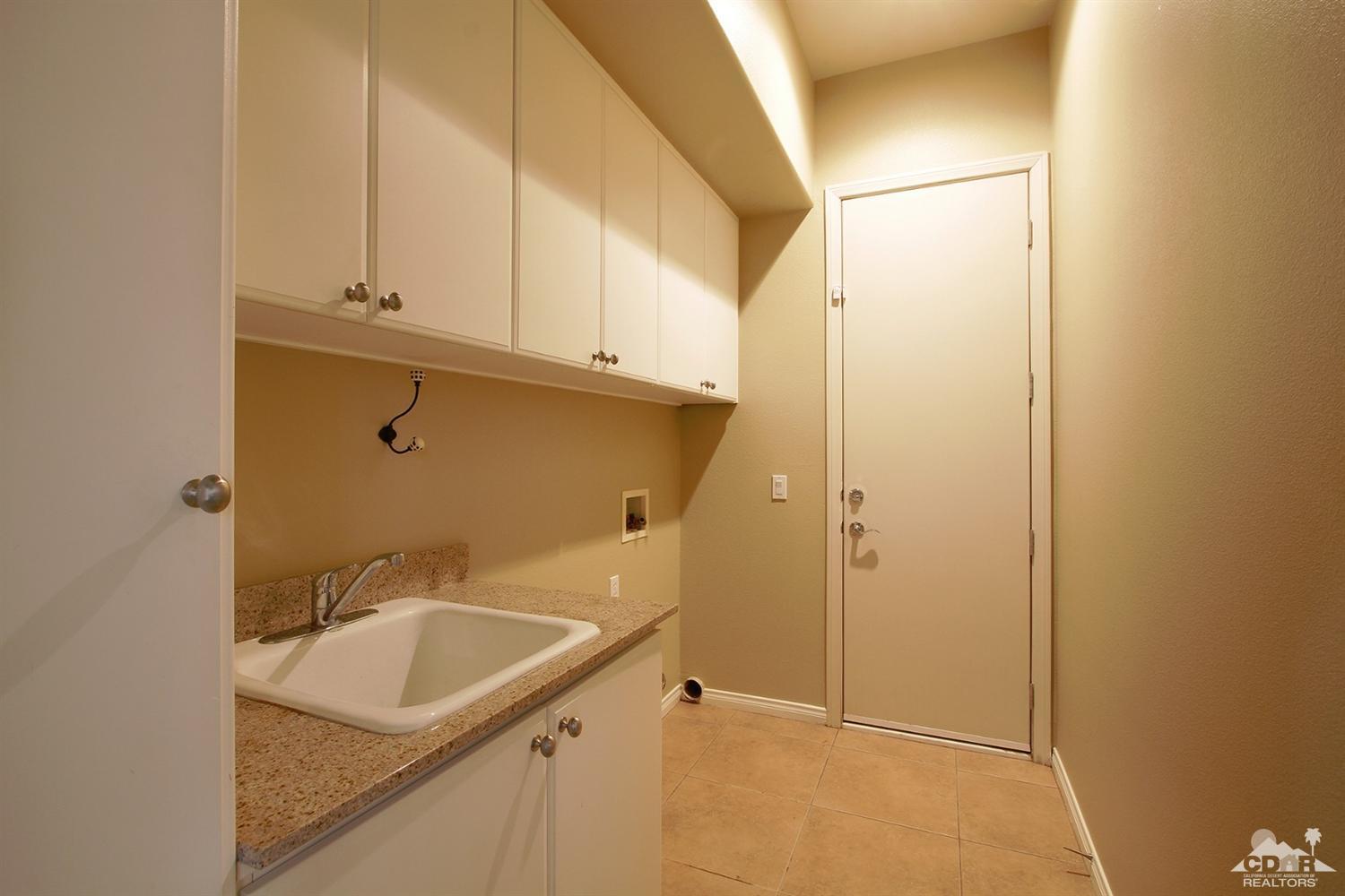 4 Orleans Road Rancho Mirage, CA 92270 - Photo 28 of 35 a bathroom with a sink and mirror