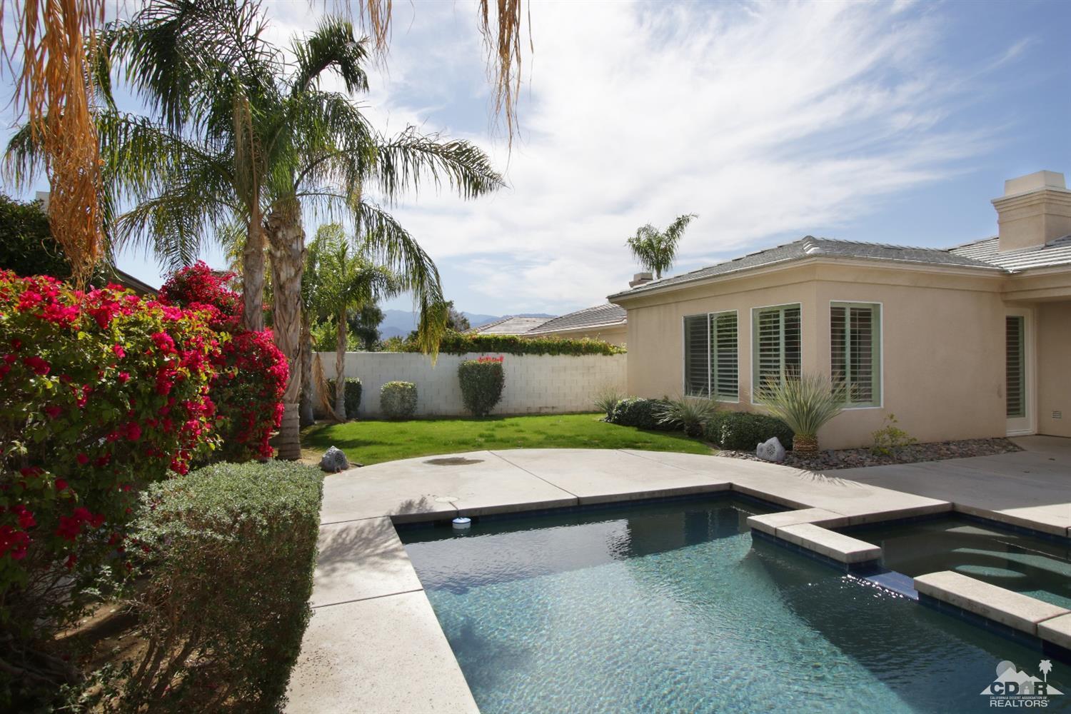 4 Orleans Road Rancho Mirage, CA 92270 - Photo 29 of 35 a view of a house with backyard and sitting area
