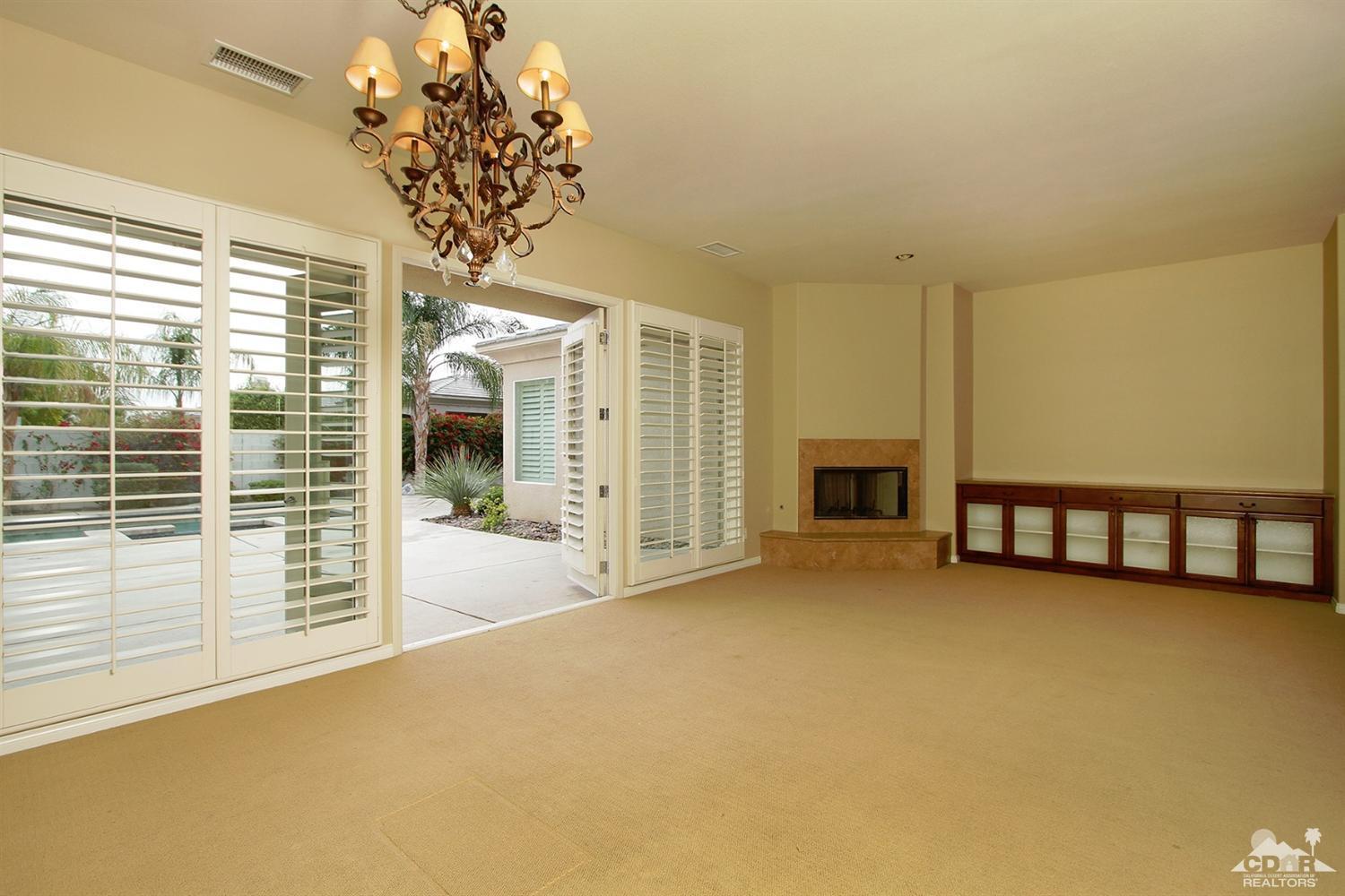 4 Orleans Road Rancho Mirage, CA 92270 - Photo 9 of 35 a view of a livingroom with an empty space and a balcony