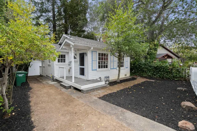 front view of a house with a yard