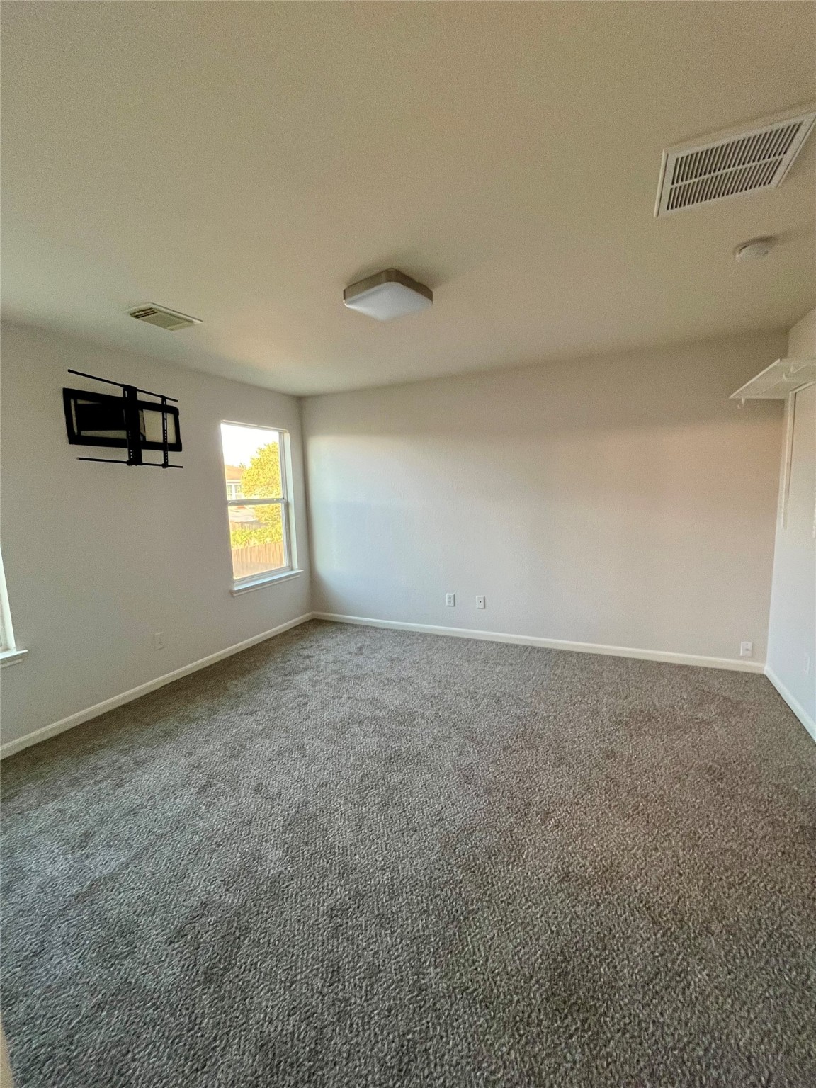 2655 Skyview Shadows Court Houston, TX 77047 - Photo 7 of 9 a view of an empty room and window