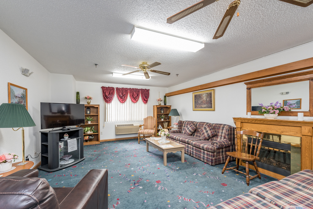 3305 Sunset Avenue, Unit 129 Waukegan, IL 60087 - Photo 12 of 20 a living room with furniture a flat screen tv and a fireplace
