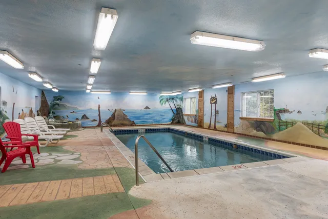a view of a swimming pool and lounge chair