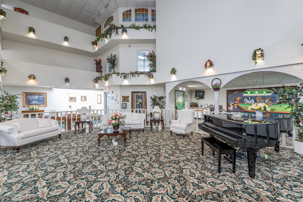 3305 Sunset Avenue, Unit 129 Waukegan, IL 60087 - Photo 10 of 20 a living room with fireplace furniture and a chandelier