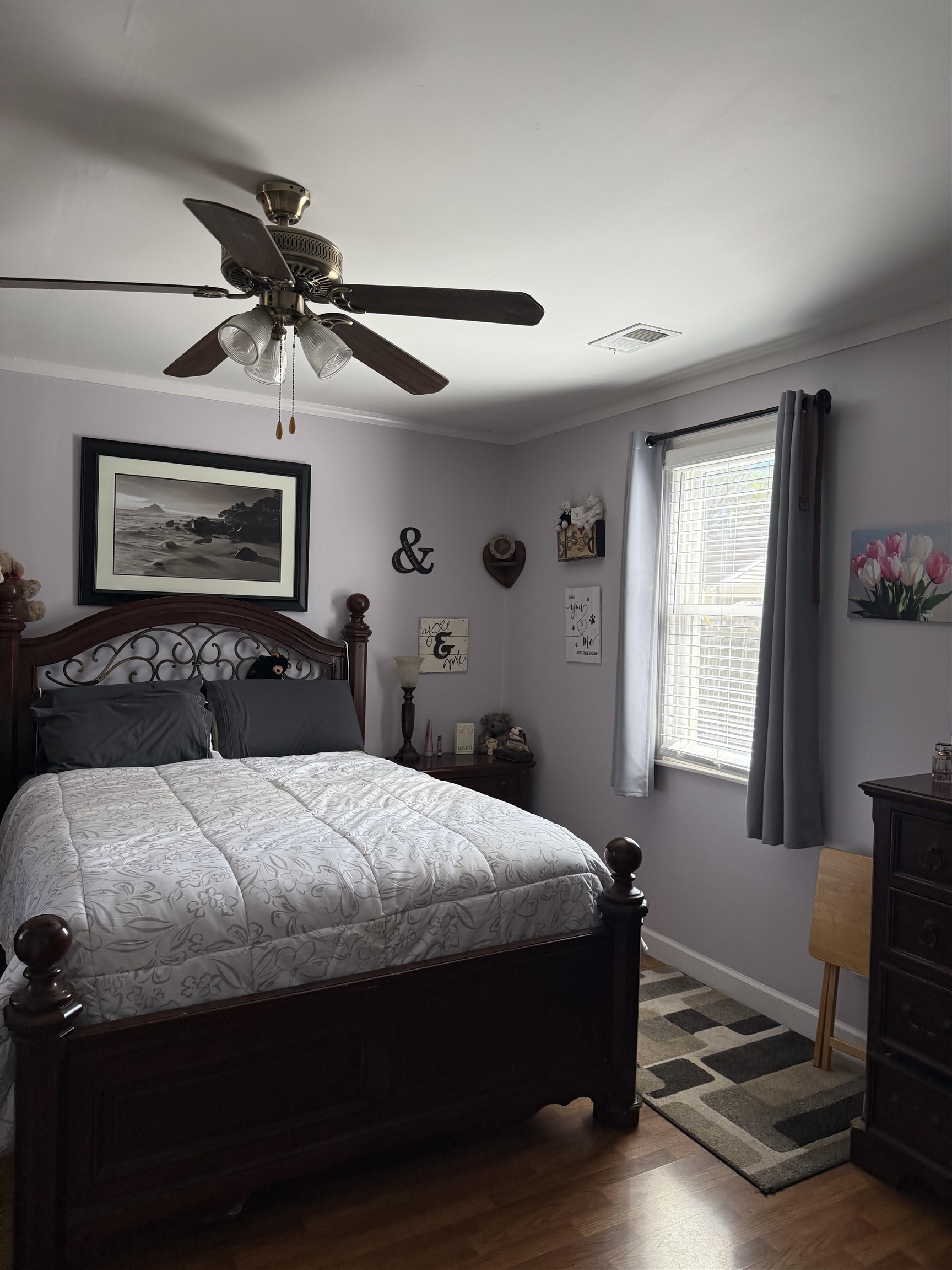 1332 Wells Station Road Memphis, TN 38108 - Photo 11 of 23 Bedroom with crown molding, dark wood-type flooring, and ceiling fan