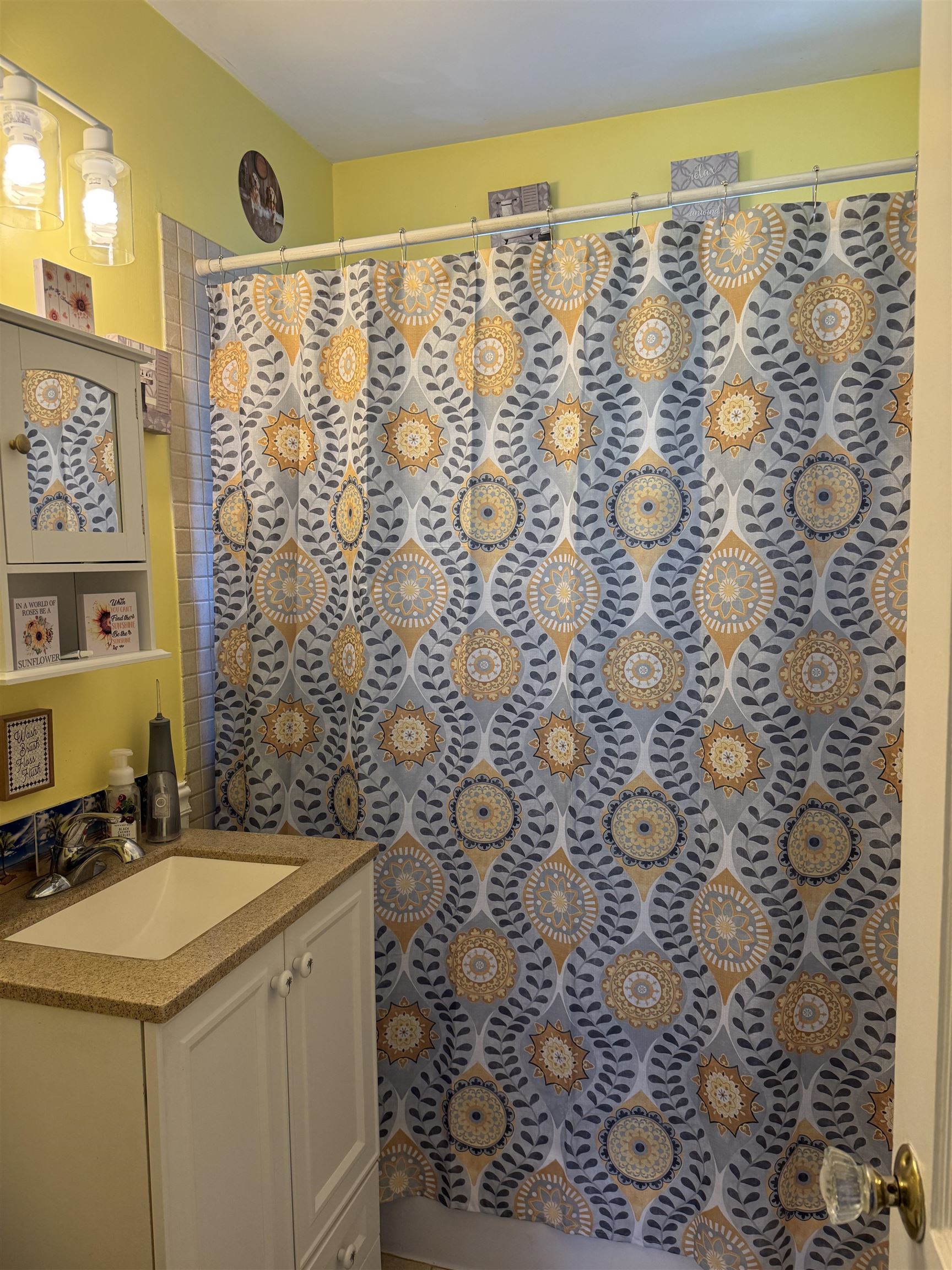 1332 Wells Station Road Memphis, TN 38108 - Photo 13 of 23 Bathroom with a shower with vanity