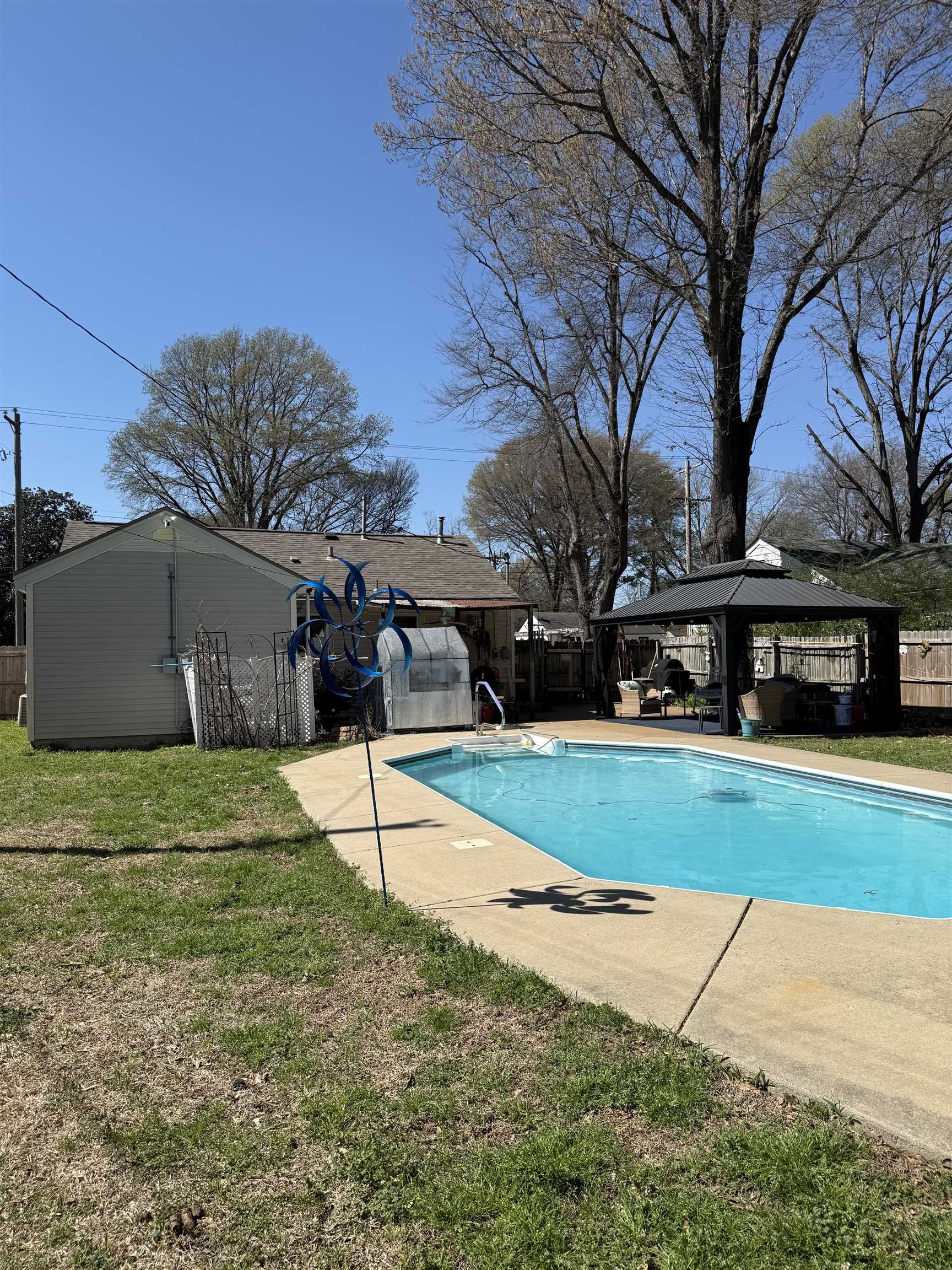 1332 Wells Station Road Memphis, TN 38108 - Photo 14 of 23 View of pool featuring a gazebo, a fenced backyard, and patio surround