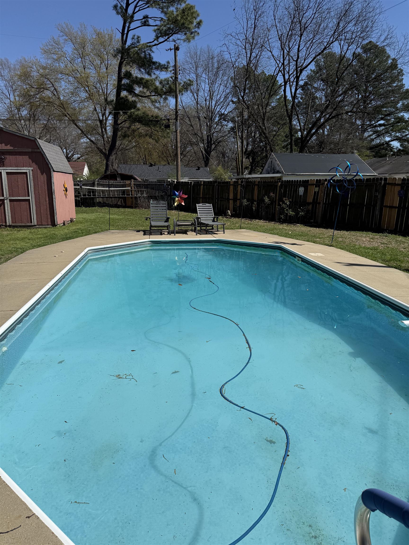 1332 Wells Station Road Memphis, TN 38108 - Photo 21 of 23 View of pool featuring a fenced backyard, a storage unit, and patio surround