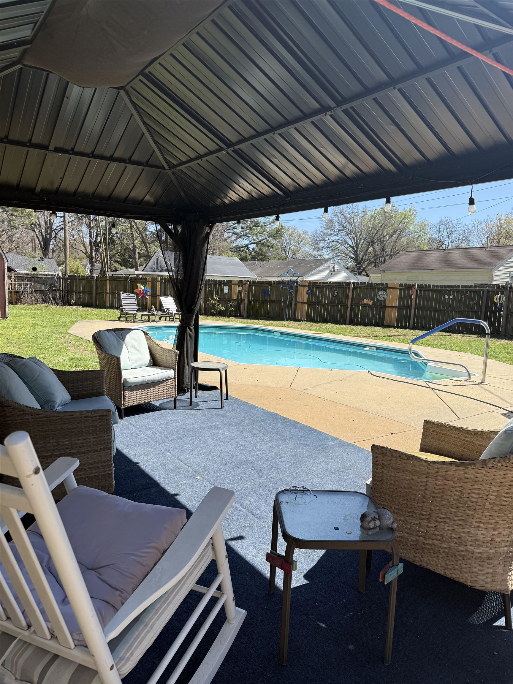 1332 Wells Station Road Memphis, TN 38108 - Photo 22 of 23 View of swimming pool featuring patio surround and a fenced backyard