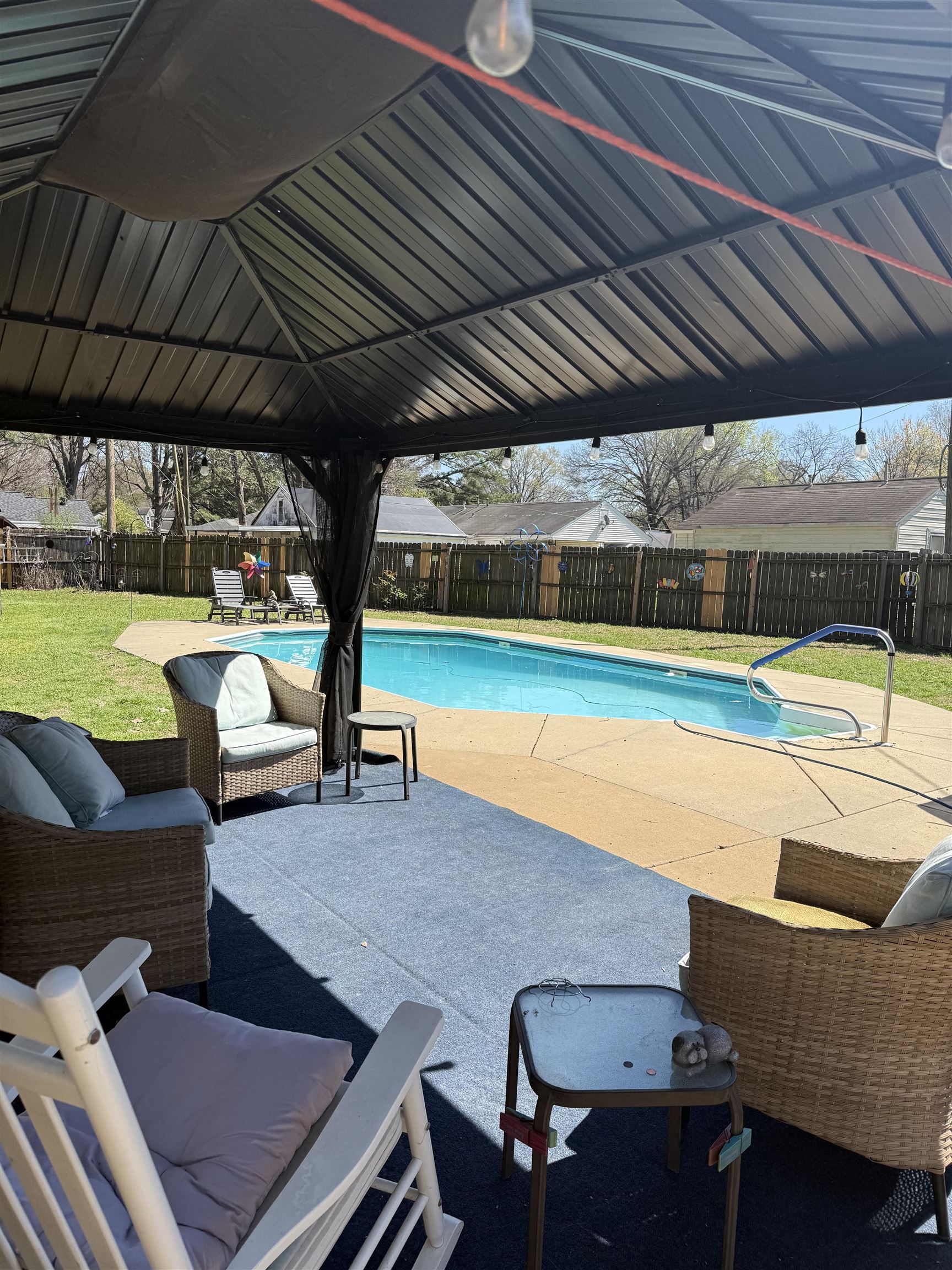 1332 Wells Station Road Memphis, TN 38108 - Photo 23 of 23 View of swimming pool featuring patio surround, a fenced backyard, and an outdoor living space