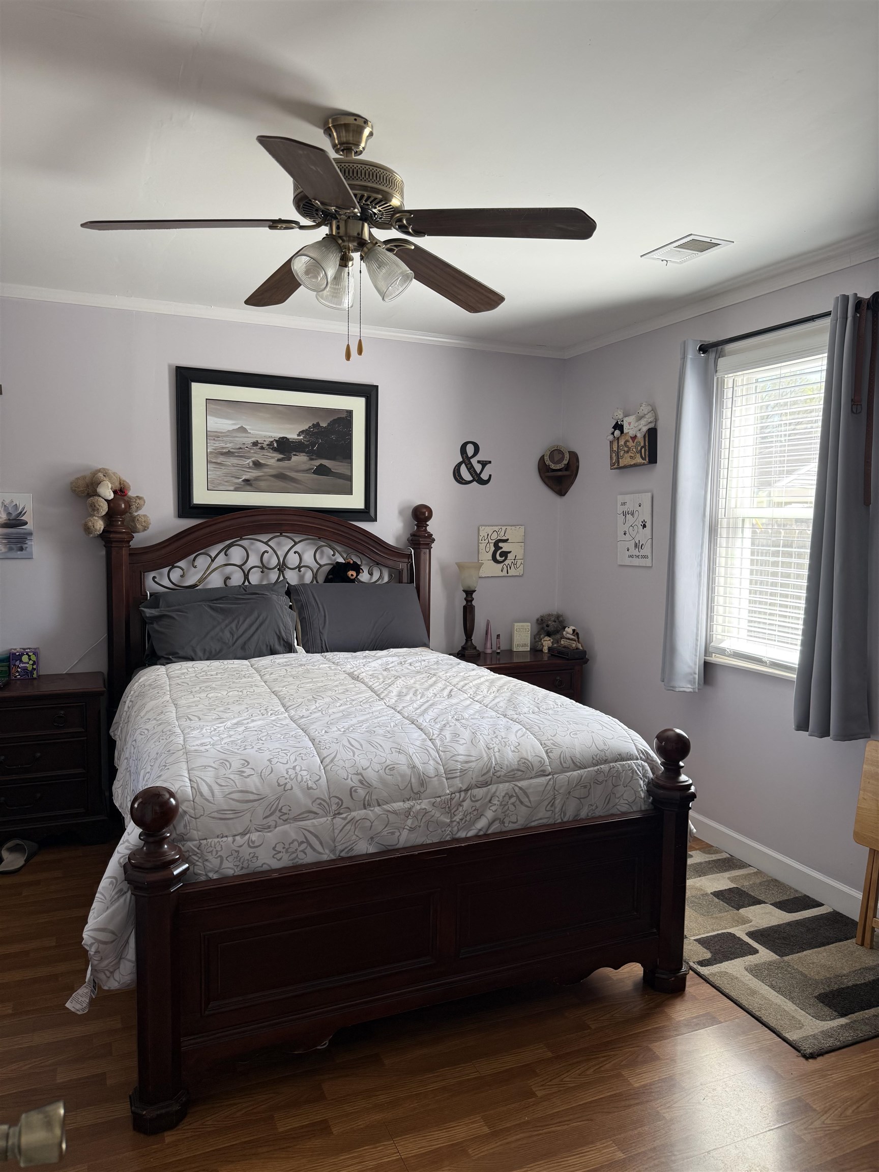 1332 Wells Station Road Memphis, TN 38108 - Photo 9 of 23 Bedroom featuring ornamental molding, dark wood-style flooring, and a ceiling fan