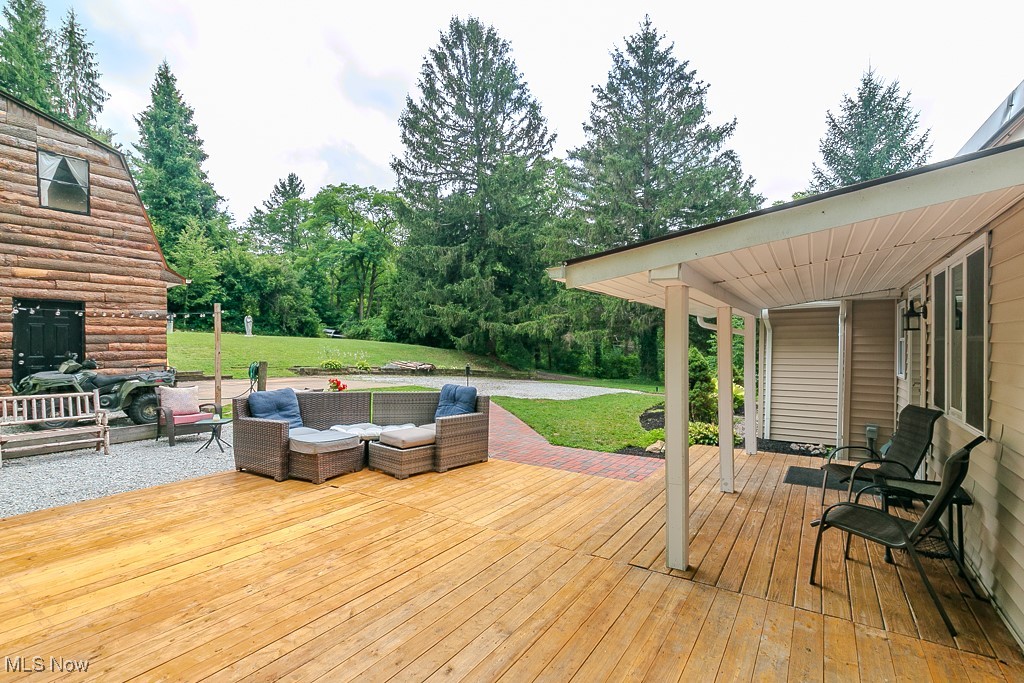 9723 Thwing Road Chardon, OH 44024 - Photo 36 of 42 Deck with outdoor lounge area and a lawn