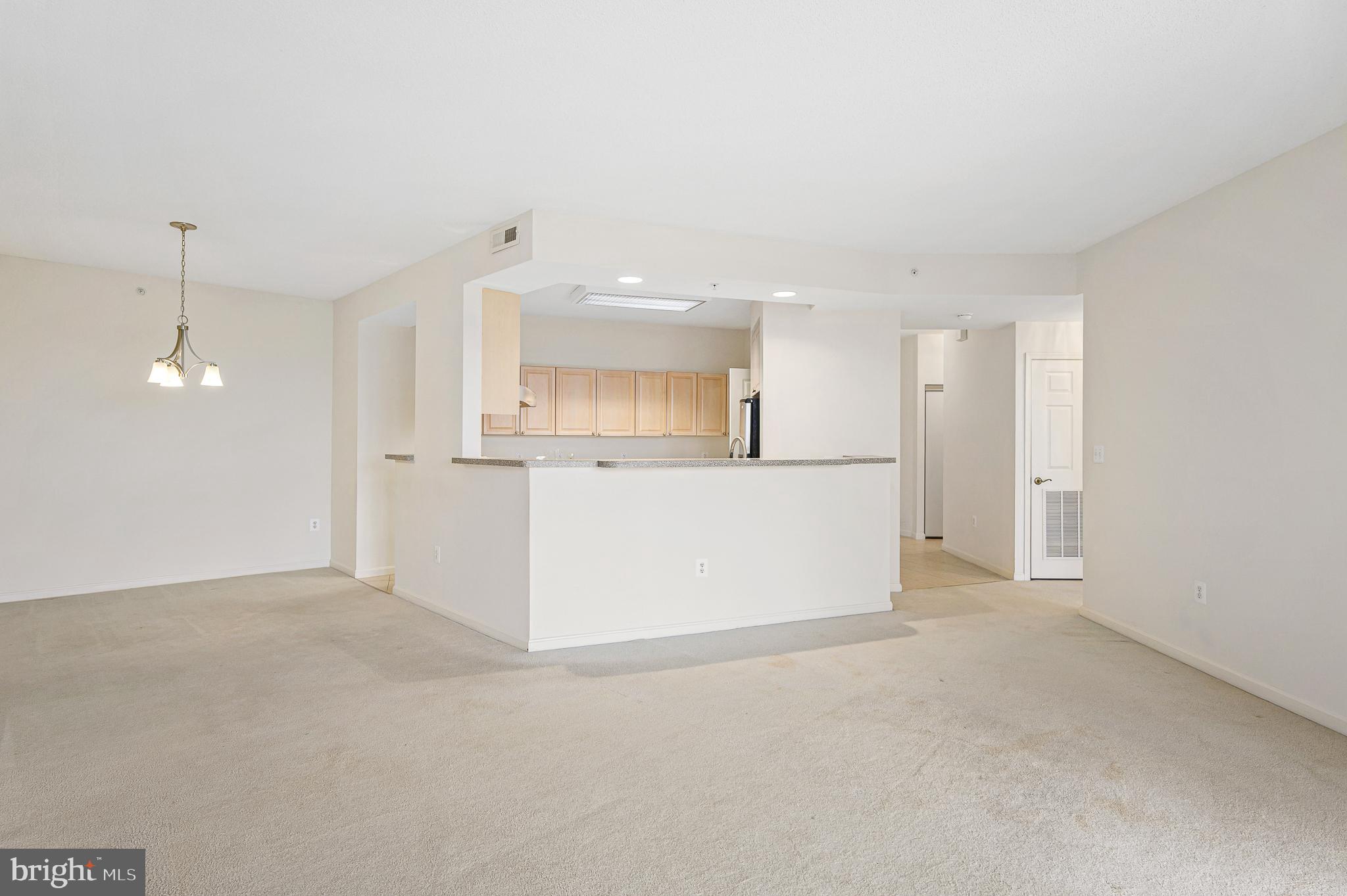 19355 Cypress Ridge Terrace, Unit 515 Leesburg, VA 20176 - Photo 2 of 33 Living/Dining/Kitchen