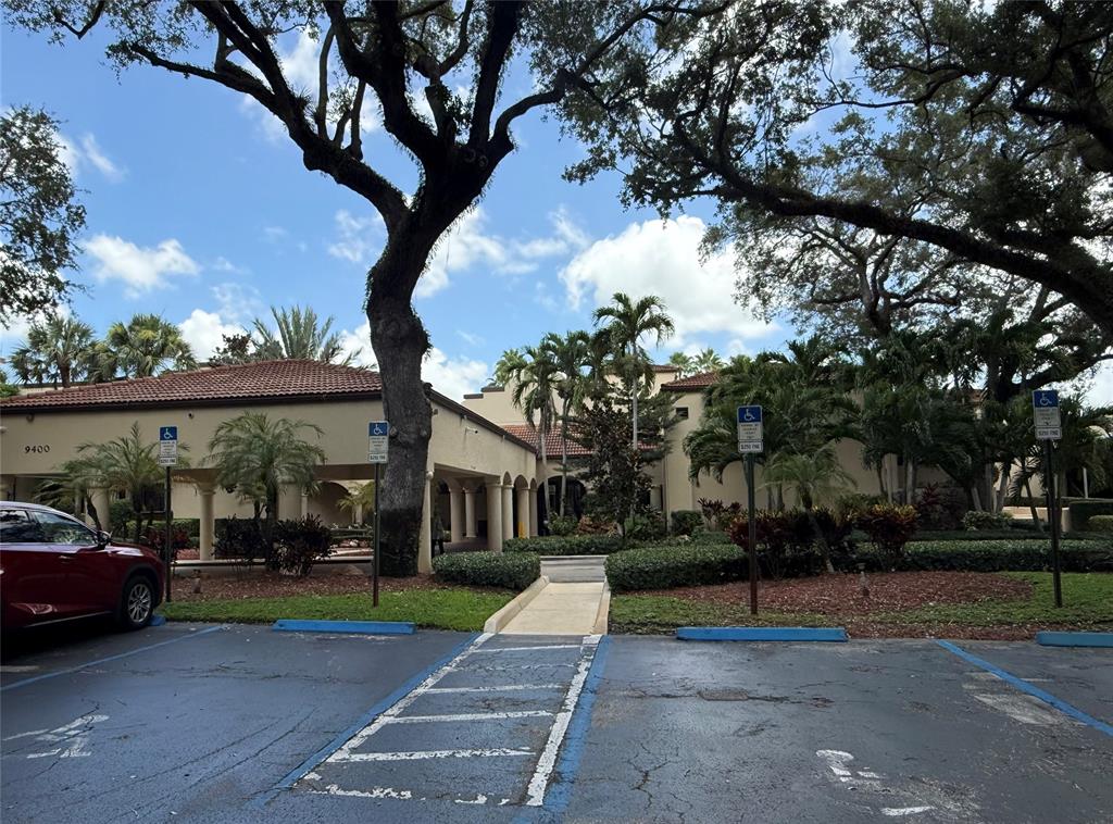 9450 Live Oak Place, Unit 303 Davie, FL 33324 - Photo 18 of 24 a view of street with parked cars