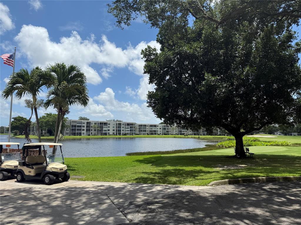 9450 Live Oak Place, Unit 303 Davie, FL 33324 - Photo 19 of 24 a view of a park with large trees