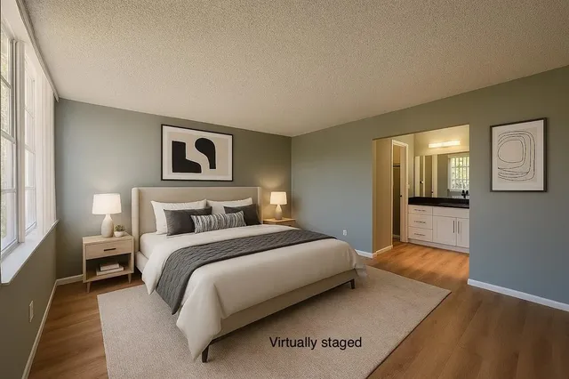 a bedroom with a large bed and a couch