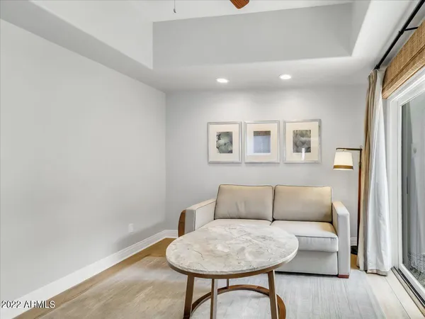 a living room with furniture and a rug