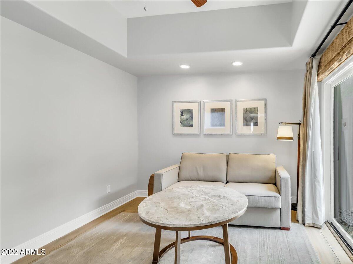 6000 East Camelback Road, Unit 7707 Scottsdale, AZ 85251 - Photo 25 of 42 a living room with furniture and a rug