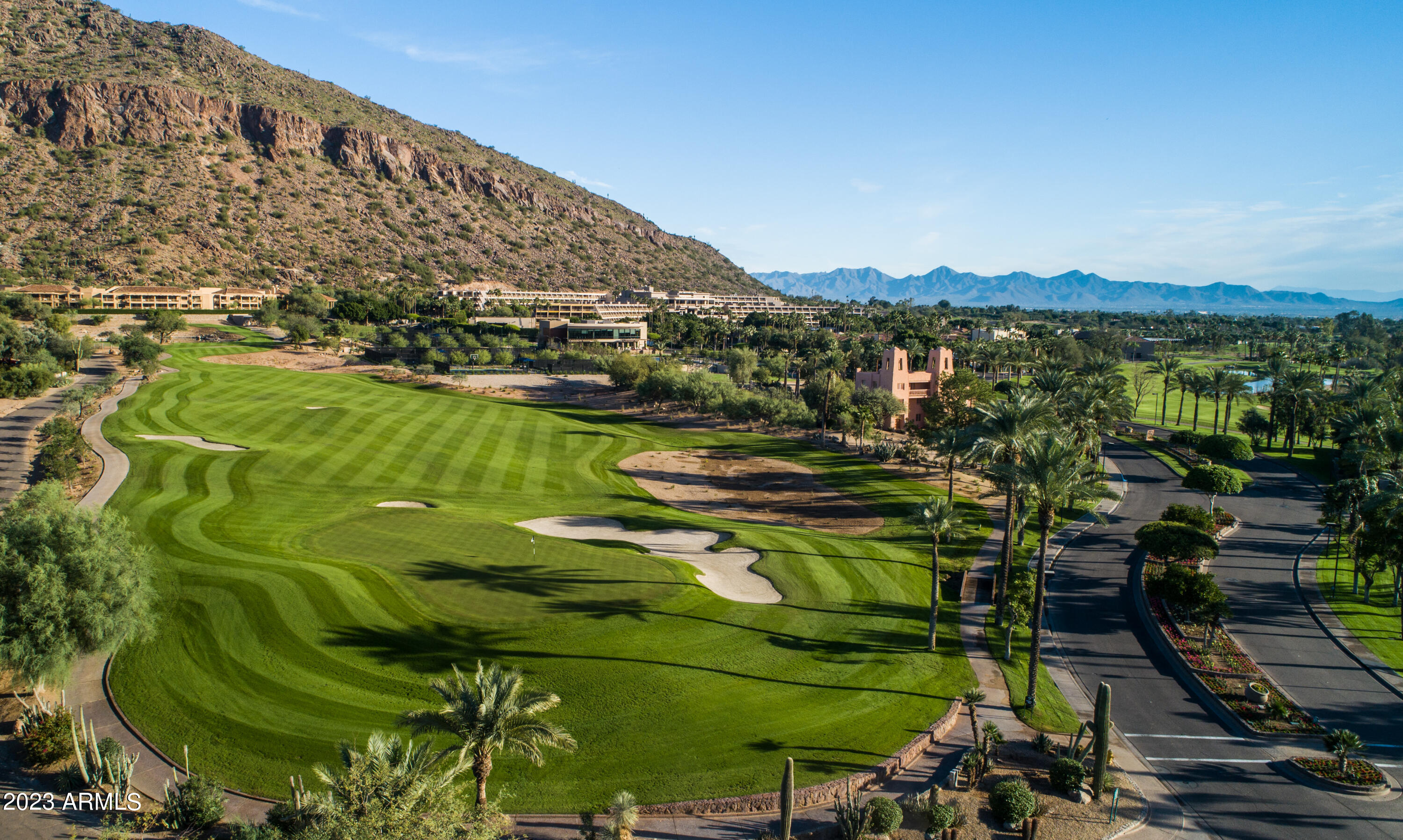 6000 East Camelback Road, Unit 7707 Scottsdale, AZ 85251 - Photo 3 of 42 a view of a lake with a building in the background