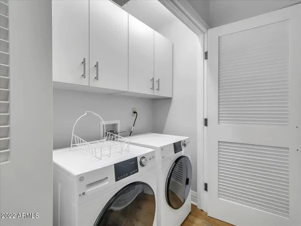 a utility room with dryer and washer