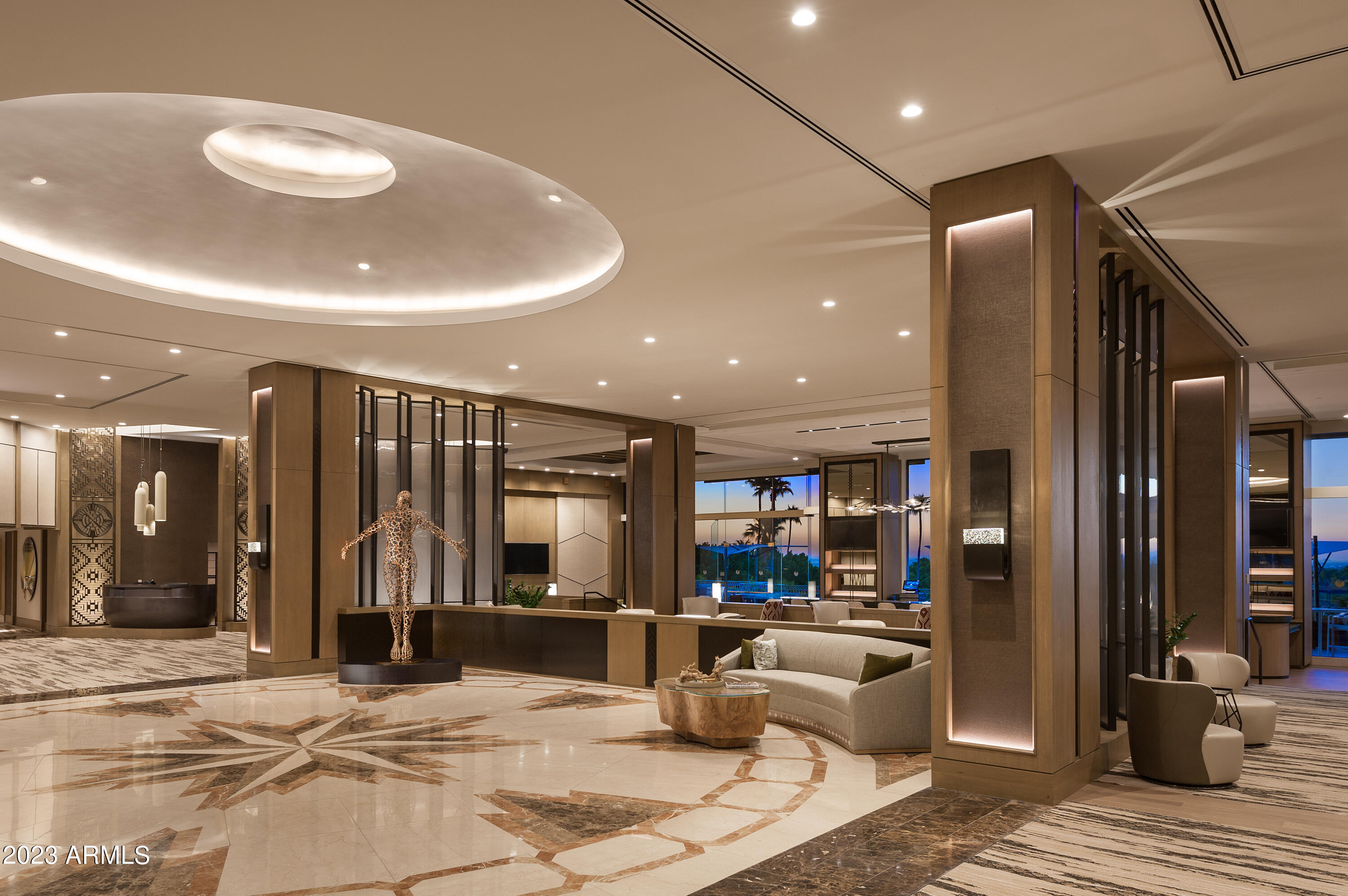 6000 East Camelback Road, Unit 7707 Scottsdale, AZ 85251 - Photo 38 of 42 a lobby with furniture and a potted plant